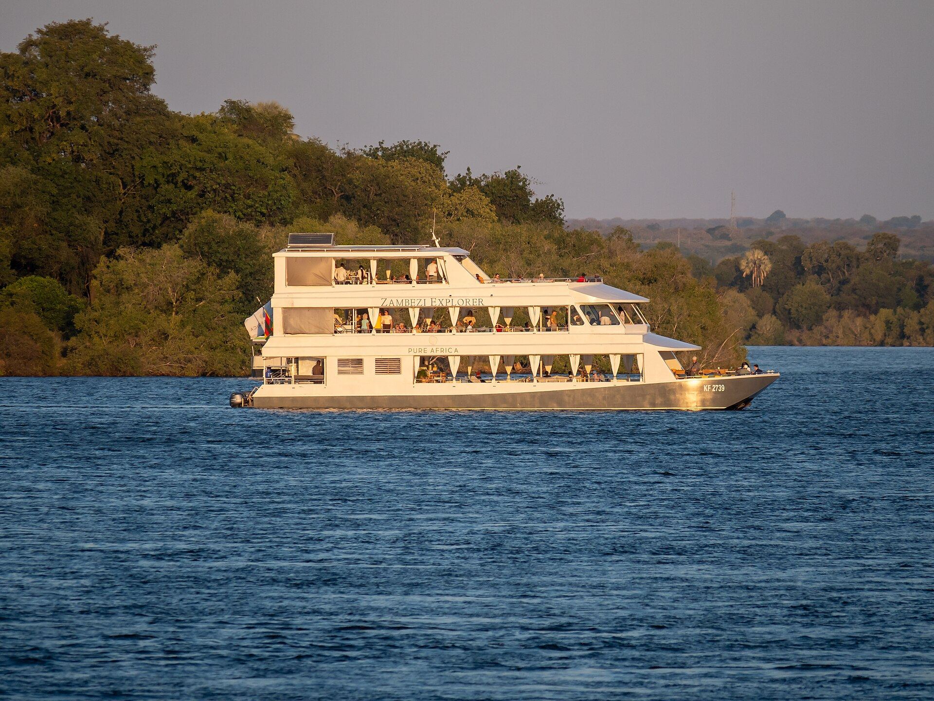 Golden light over the Zambezi River during an evening cruise at Livingstone, Zambia
